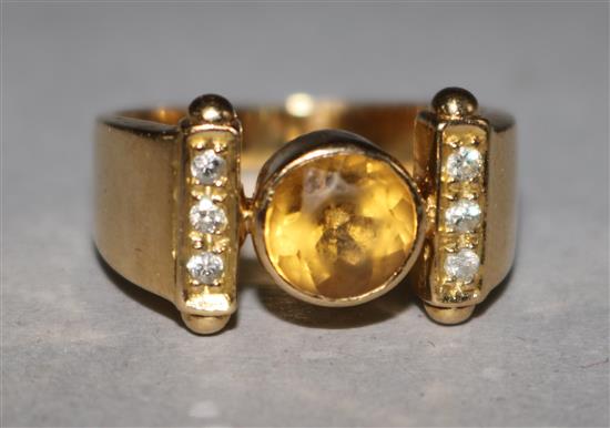 An 18ct gold yellow sapphire & diamond set dress ring, size J.